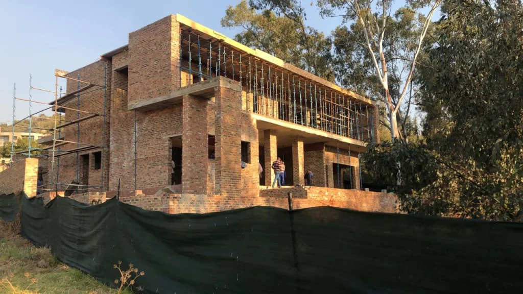 Sugarbush Residence — site progress showing the double-storey structure within its golf-estate setting
