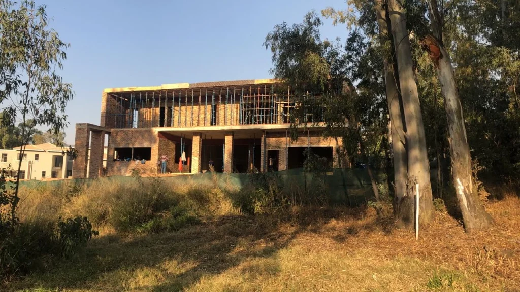 Sugarbush Residence — site progress showing the double-storey structure within its golf-estate setting